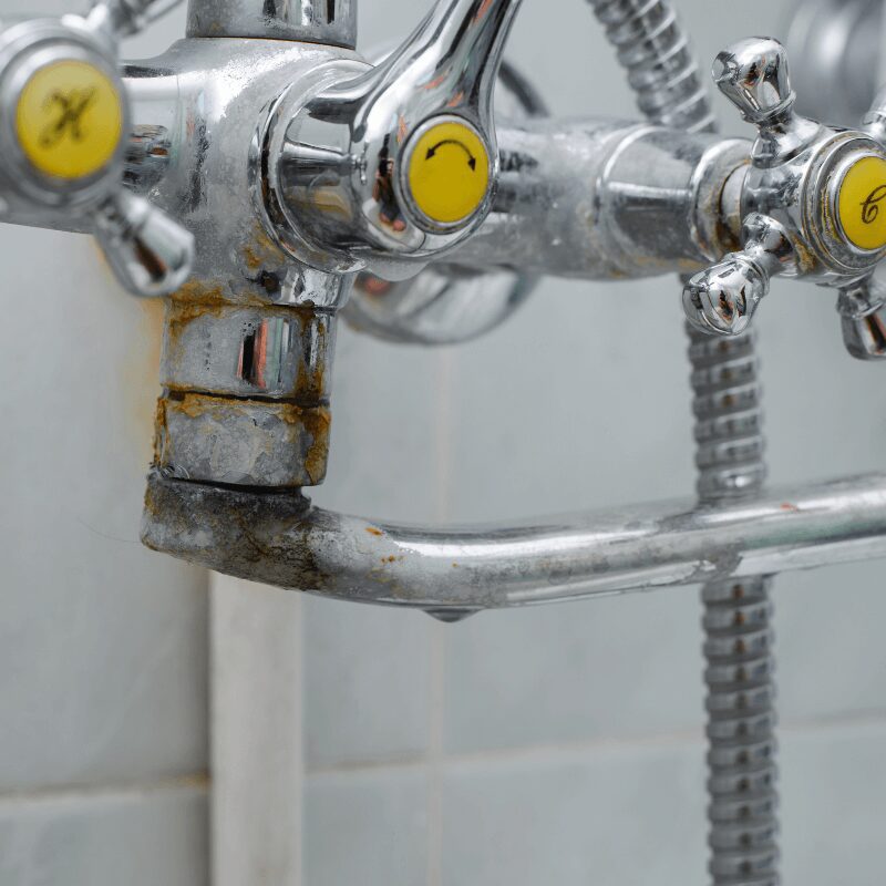 rusty bathroom faucet and plumbing from hard water